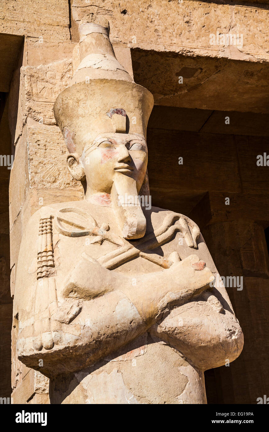 Osiride statue at the temple of Queen Hatshepsut in Deir el-Bahari in Egypt. Stock Photo