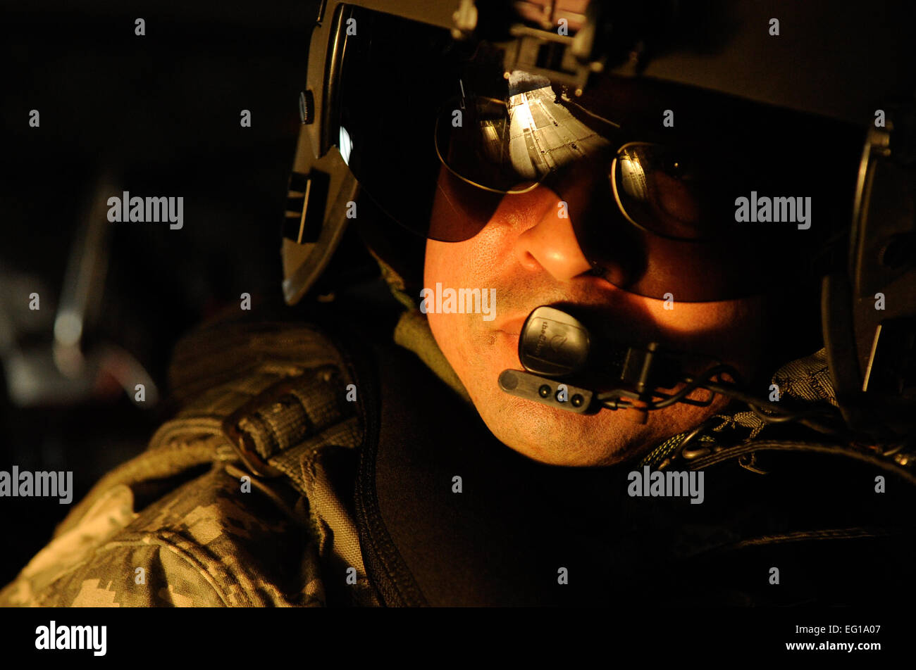 A U.S. Army CH-47 Chinook flight engineer assigned to the 160th Special Operations Aviation Regiment, looks out the open ramp of a CH-47 helicopter while in flight, March 1, 2011 over the Gulf of Mexico in support of Emerald Warrior 2011. Emerald Warrior 2011 is a U.S. Special Operations Command-sponsored, multiservice exercise designed to leverage lessons learned from Operations Iraqi Freedom and Enduring Freedom to provide trained and ready forces to combatant commanders.  Tech Sgt. Manuel J. MartinezReleased Stock Photo