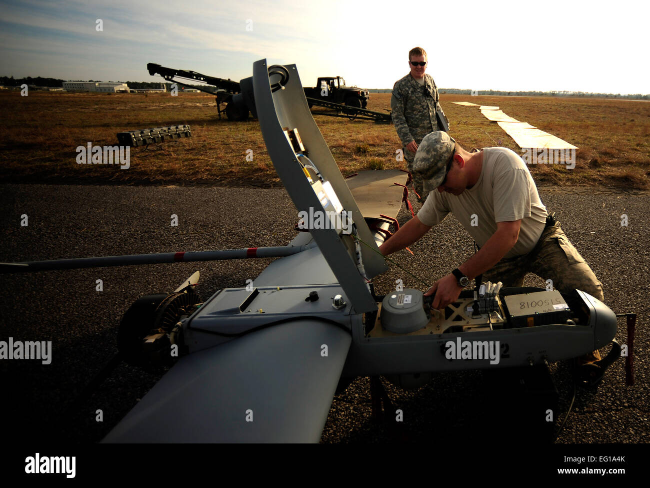 U.S. Army Soldiers assigned to the 10th Special Forces Group, Unmanned Aerial Systems Det., Fort Carson, Colo., break down an RQ-7B Shadow unmanned aerial vehicle during Emerald Warrior on March 7, 2011. Emerald Warrior is a U.S. Special Operations Command-sponsored, multiservice exercise designed to leverage lessons learned from Operations Iraqi Freedom and Enduring Freedom to provide trained and ready forces to combatant commanders.  SSgt Andy M. KinReleased Stock Photo