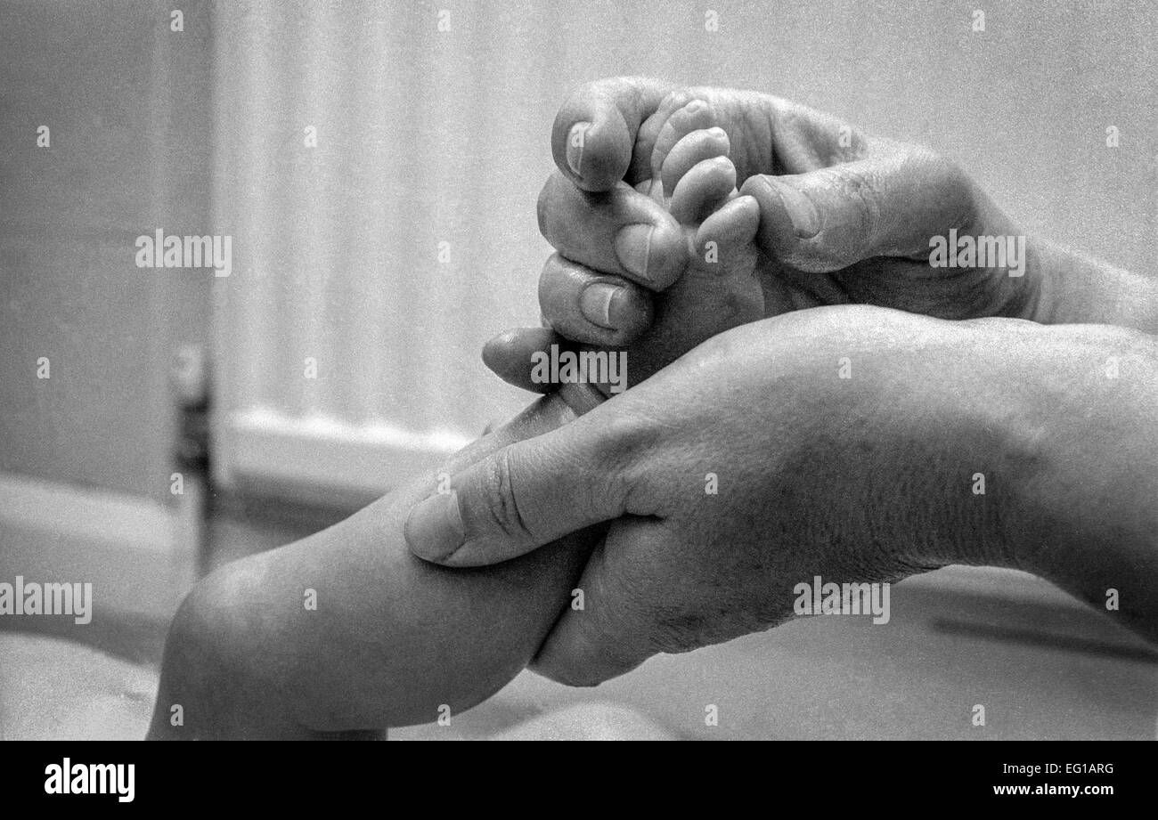 Baby massage to help the baby relax Stock Photo Alamy