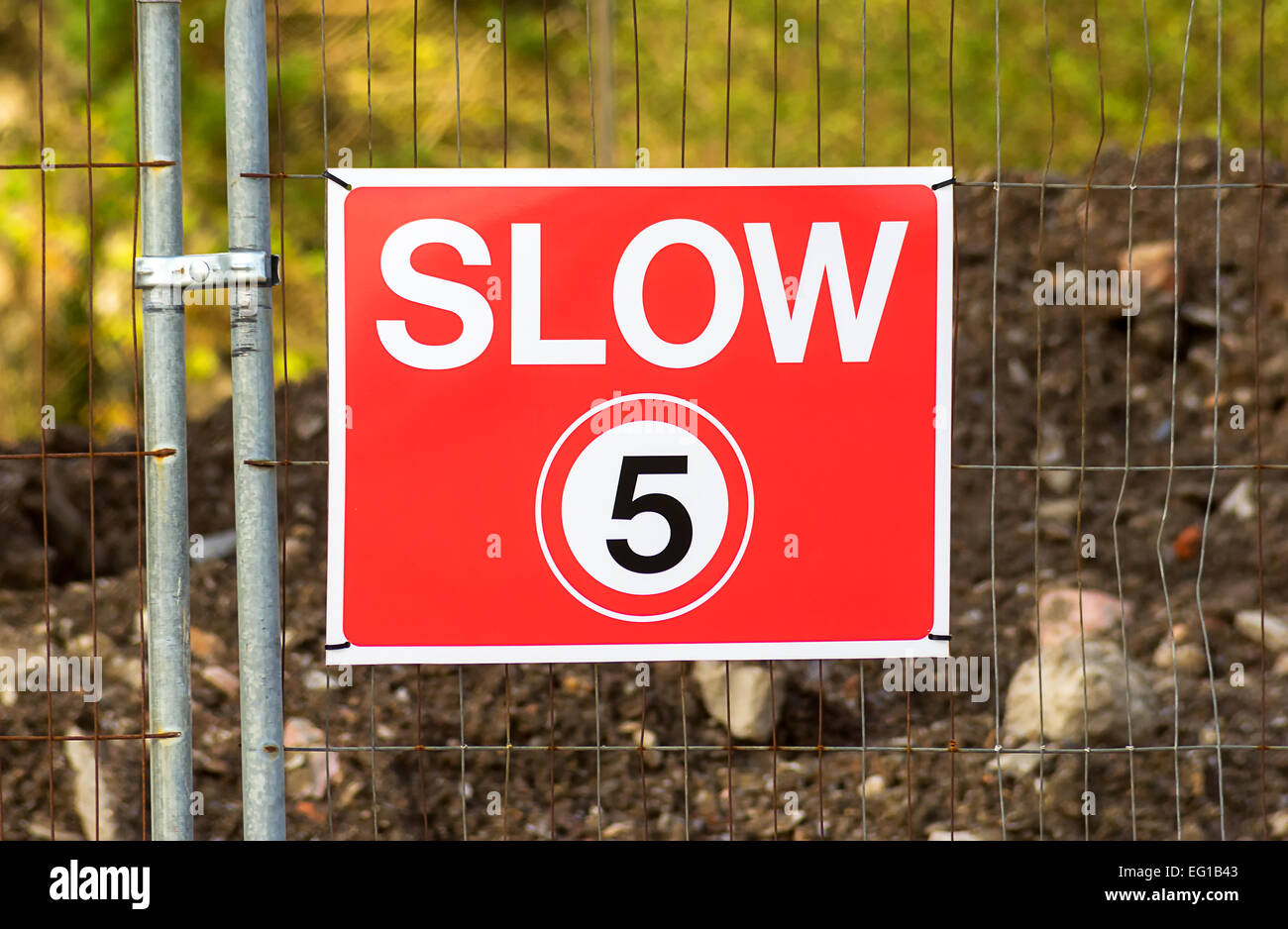Slow,Number 5,Fence,Speed Limit Sign,Low,Sign,Outdoors,Metal,Safety,Law