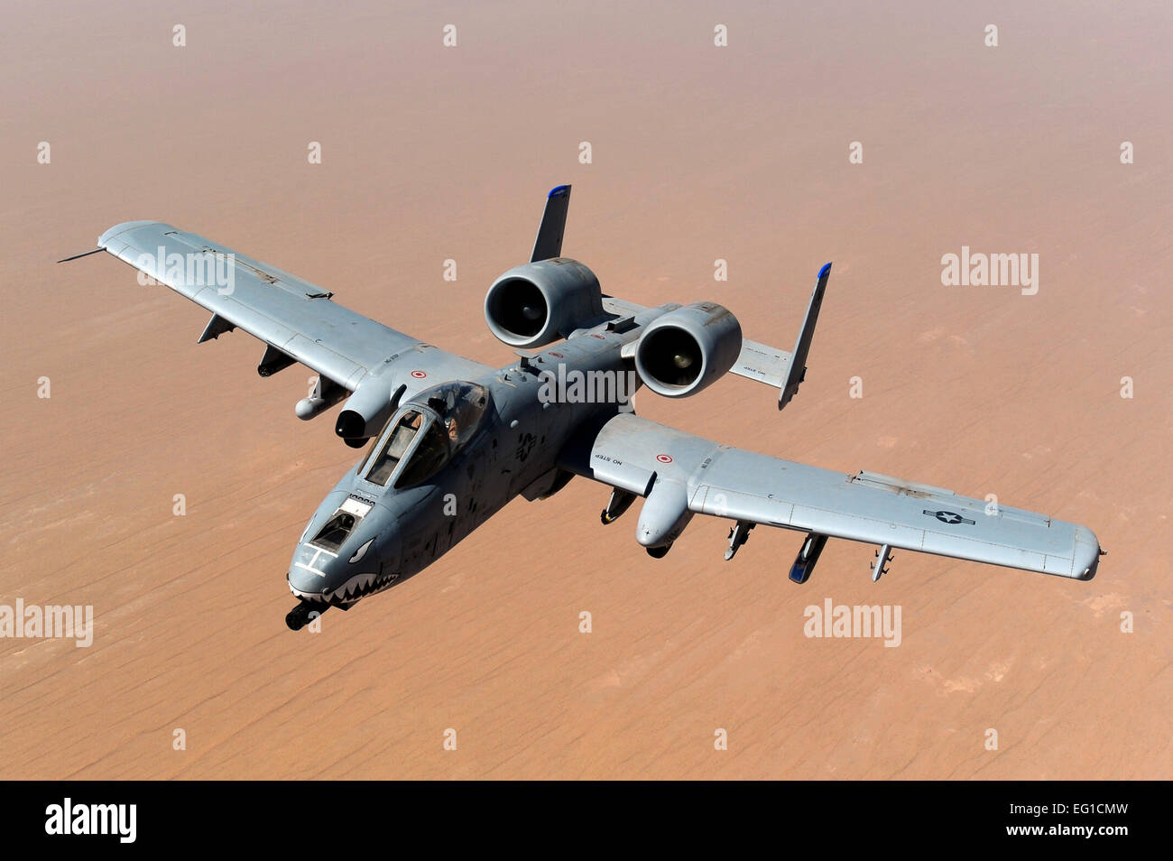 An A-10 Thunderbolt II, assigned to the 74th Fighter Squadron, Moody Air Force Base, GA, returns to mission after receiving fuel from a KC-135 Stratotanker, 340th Expeditionary Air Refueling Squadron, over the skies of Afghanistan in support of Operation Enduring Freedom, May 8, 2011.  Master Sgt. William Greer Stock Photo