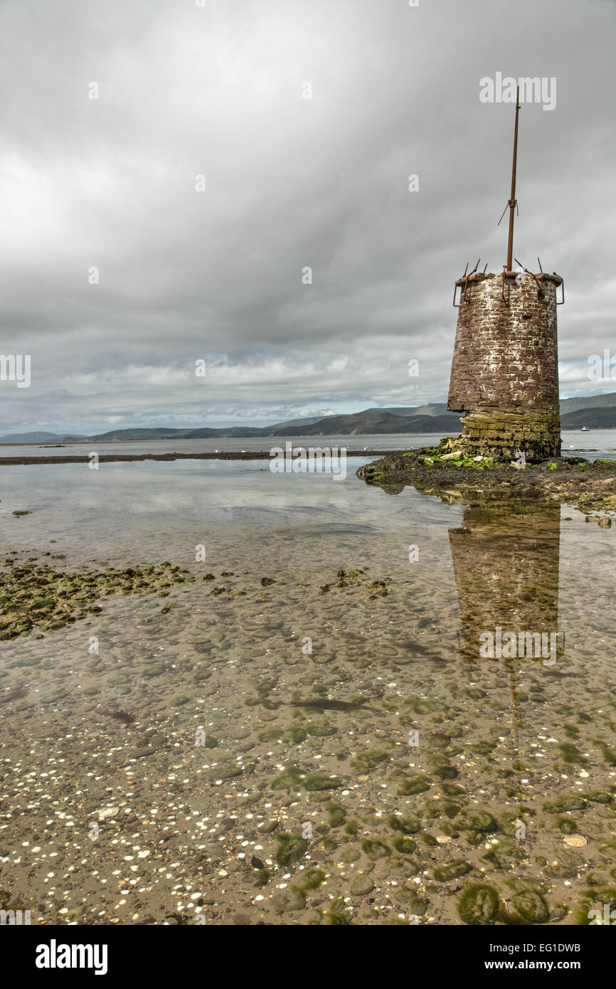 Tower near Rossbehy Point, Ireland with reflection in water Stock Photo
