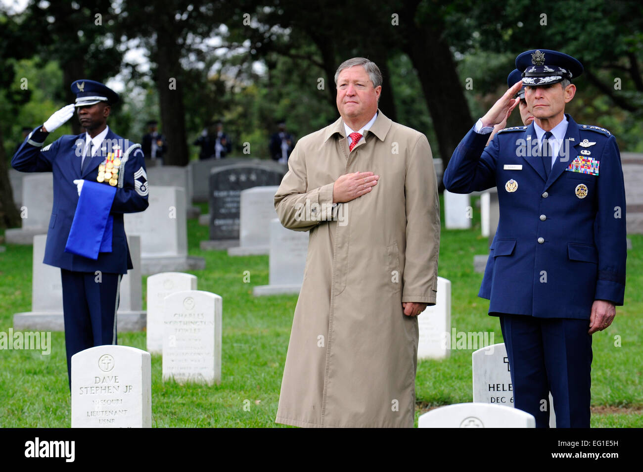 FFSecretary of the Air Force Michael Donley and Air Force Chief of Staff Gen. Norton Schwartz pay their respects Oct. 3, 2011, at Arlington National Cemetery, Va., during the full-honors funeral of retired Maj. Gen. John Alison. Alison was a war hero and founding father of the Air ForceÕs special operations forces, having served with the Flying TigersÕ 75th Fighter Squadron and the 1st Air Commando Group during World War II. Tech. Sgt. Raymond Mills Stock Photo