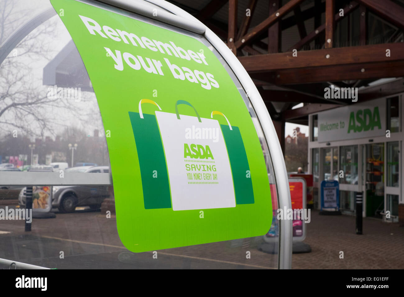 Remember your bags sign at Asda supermarket in Shrewsbury, Shropshire, England, UK Stock Photo