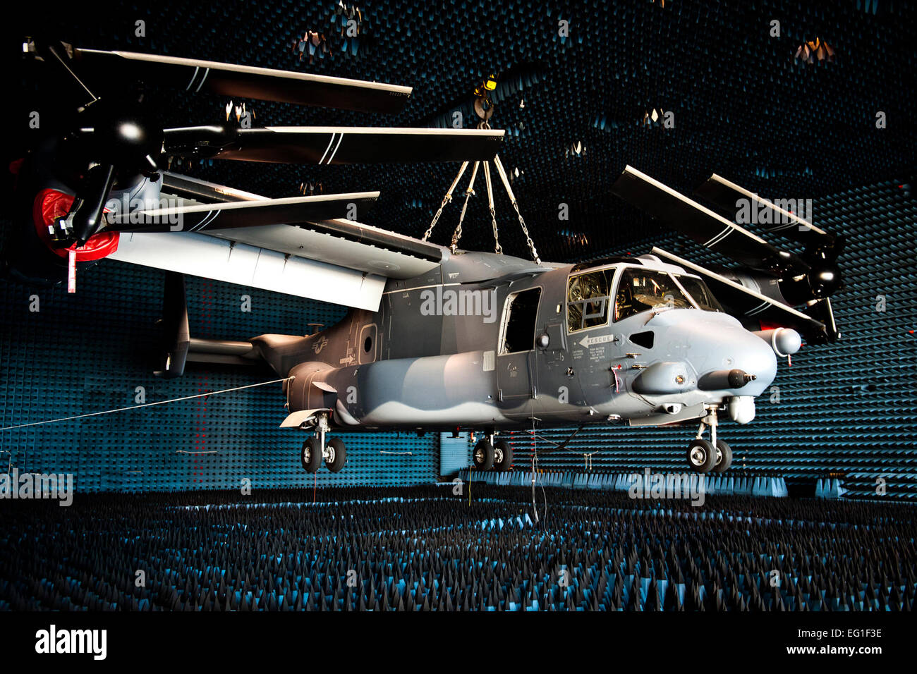 A U.S. Air Force CV-22 Osprey tiltrotor aircraft, belonging to the 8th Special Operations Squadron, hangs in the anechoic chamber at the joint preflight integration of munitions and electronic systems J-PRIMES hangar at Eglin Air Force Base, Fla., March 6, 2012. The J-PRIMES anechoic chamber is a room designed to stop internal reflections of electromagnetic waves as well as insulate from exterior sources of electromagnetic noise.  J-PRIMES provides this environment to facilitate testing air-to-air and air-to-surface munitions and electronics systems on full-scale aircraft and land vehicles pri Stock Photo