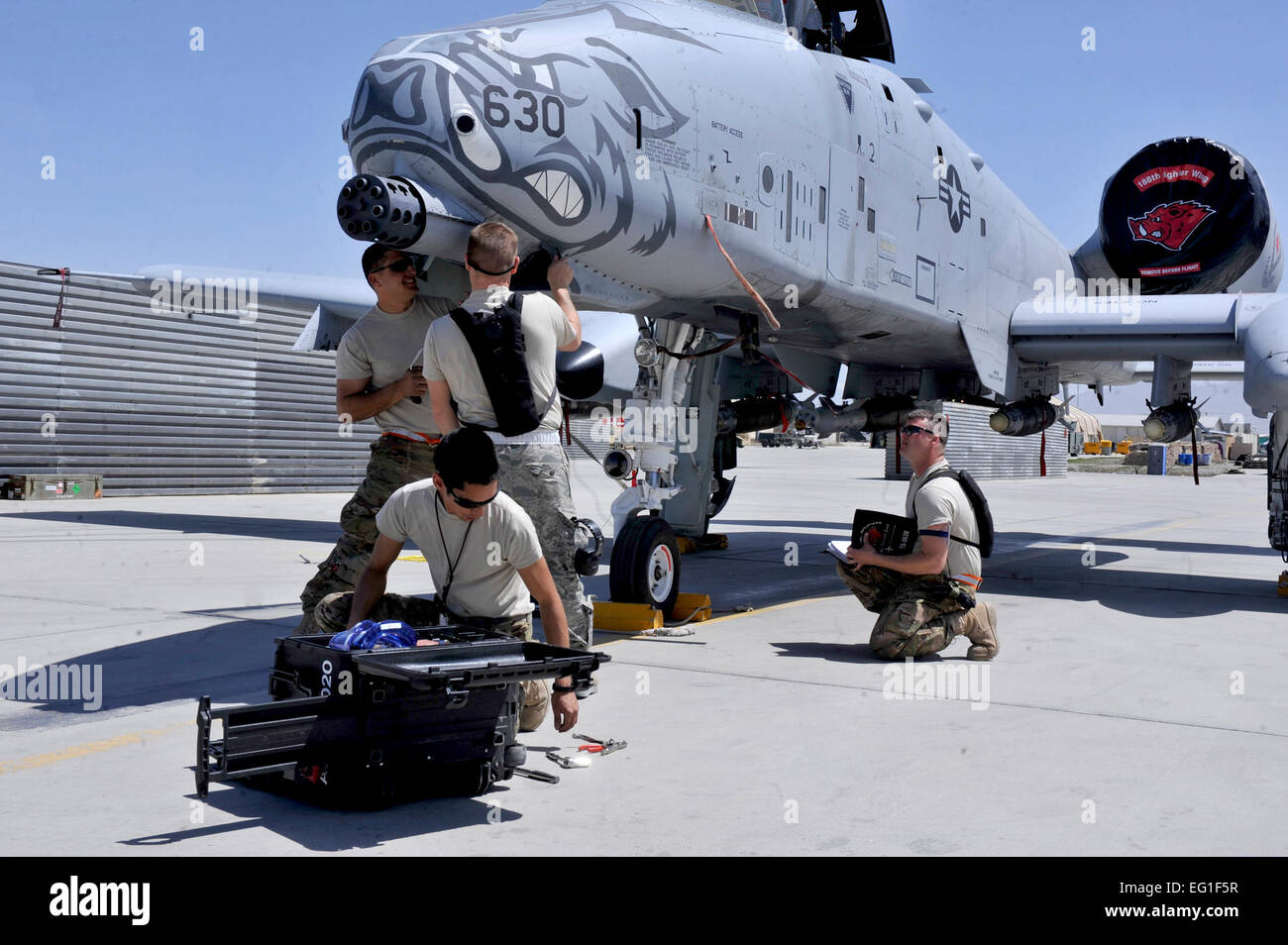 A 455th Expeditionary Aircraft Maintenance Squadron crew repairs an A-10 Thunderbolt II Aprill 6, 2012, at Bagram Airfield, Afghanistan. The 455th EAMXS is responsible for repairing and maintaining military aircraft at Bagram Airfield as well as performing preventative maintenance inspections.  Airman 1st Class Ericka Engblom Stock Photo