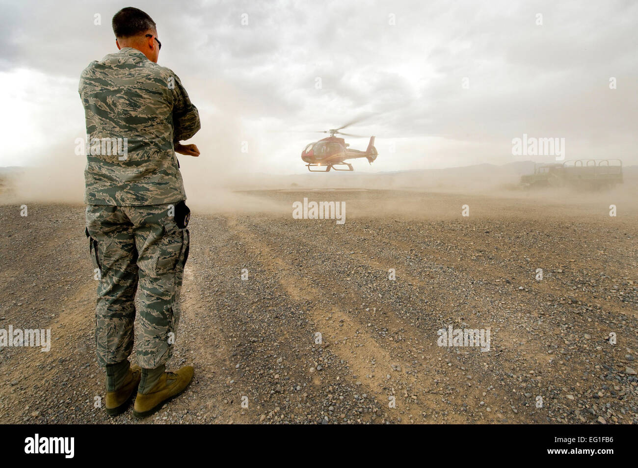 Henri Lambert marshals in a helicopter carrying Nevada Governor Brian Sandoval April 25, 2012, at the Nevada Test and Training Range.