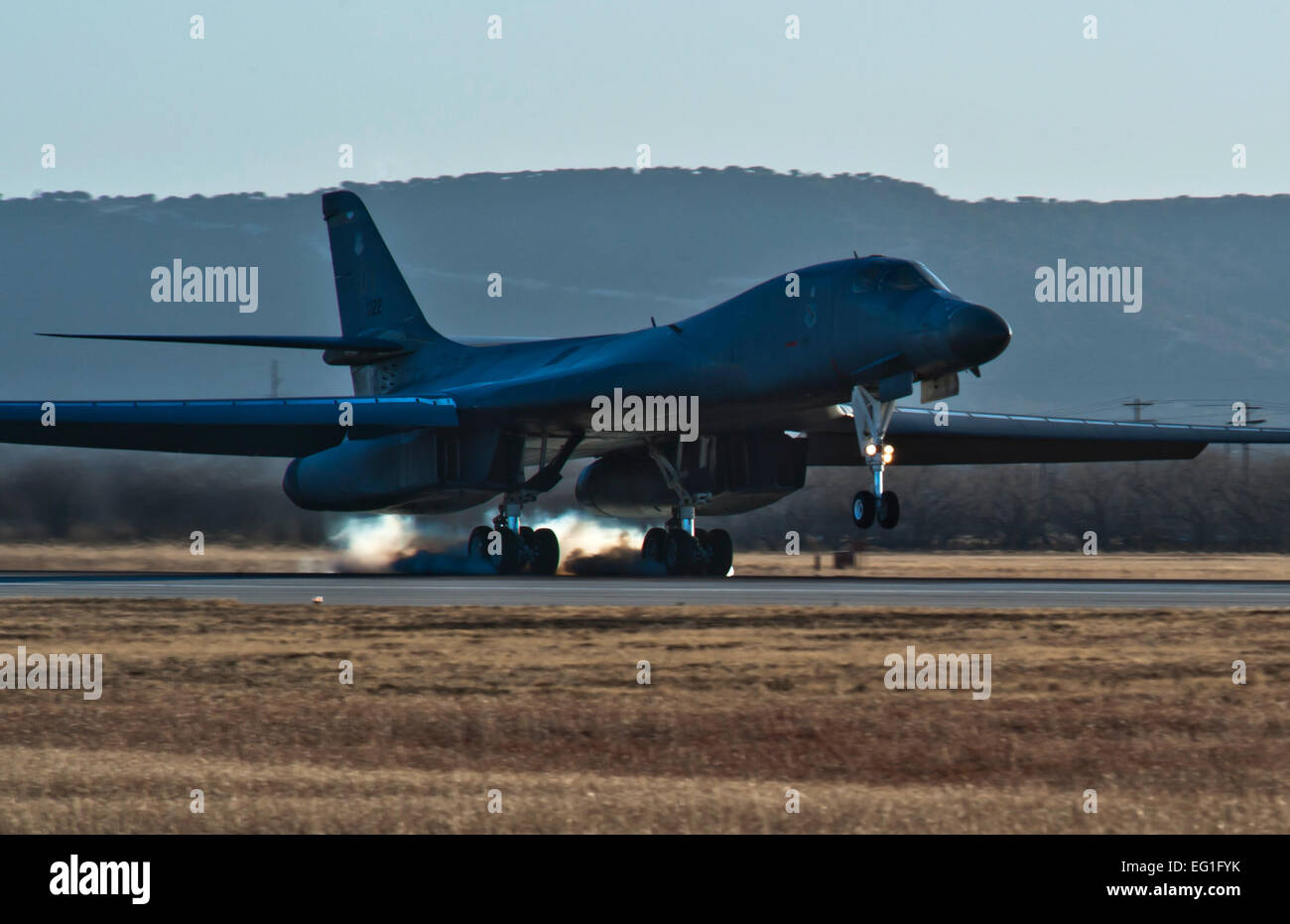 The first newly upgraded operational B1-B Lancer lands Jan. 21, 2014, at Dyess Air Force Base, Texas. The B-1B Lancer was recently upgraded with a new Integrated Battle Station. The new system includes a combination of three different upgrades. One major upgrade incorporates a modern datalink communication network that allows real-time communication with other aircraft, ground stations, and allied forces. The data link also enhances crew awareness of the battle space, and allows for quicker targeting.  Staff Sgt. Richard Ebensberger Stock Photo