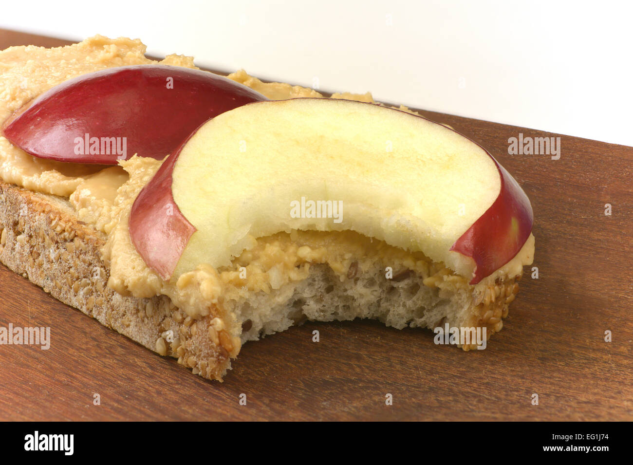 Peanut Butter And Apple Open Face Sandwich With A Bite Taken Stock Photo Alamy