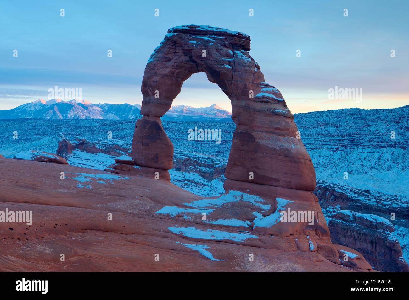 Famous Delicate Arch in Arches National Park near Moab, Utah in winter with snow. Stock Photo