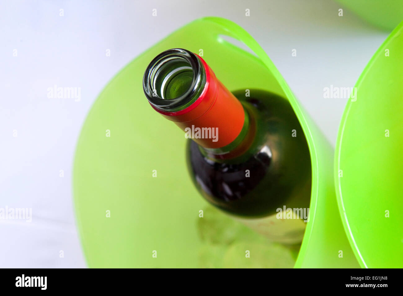 Bottle of red wine in a plastic bucket Stock Photo Alamy