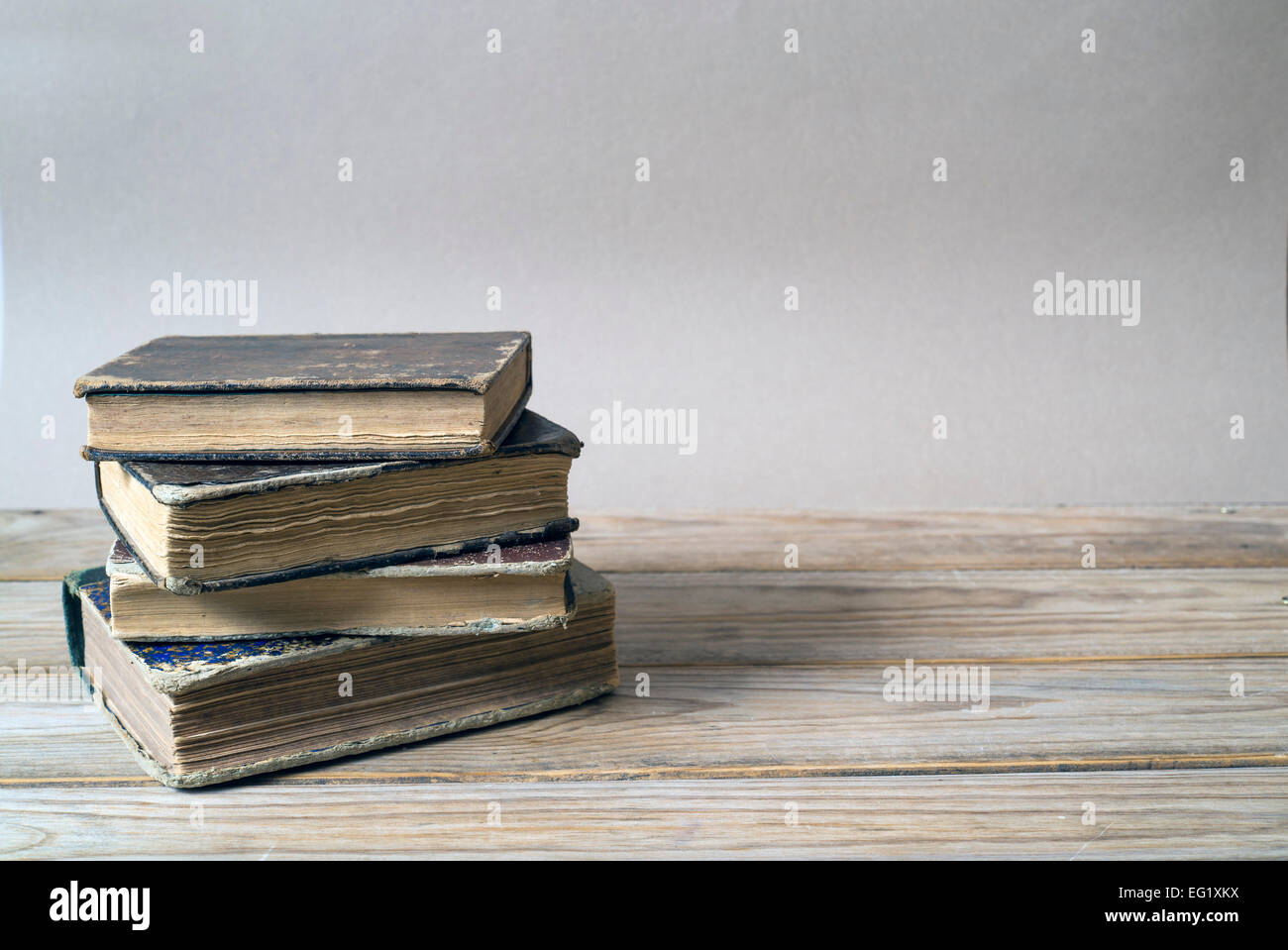 Old books on a wooden shelf. Copy space Stock Photo