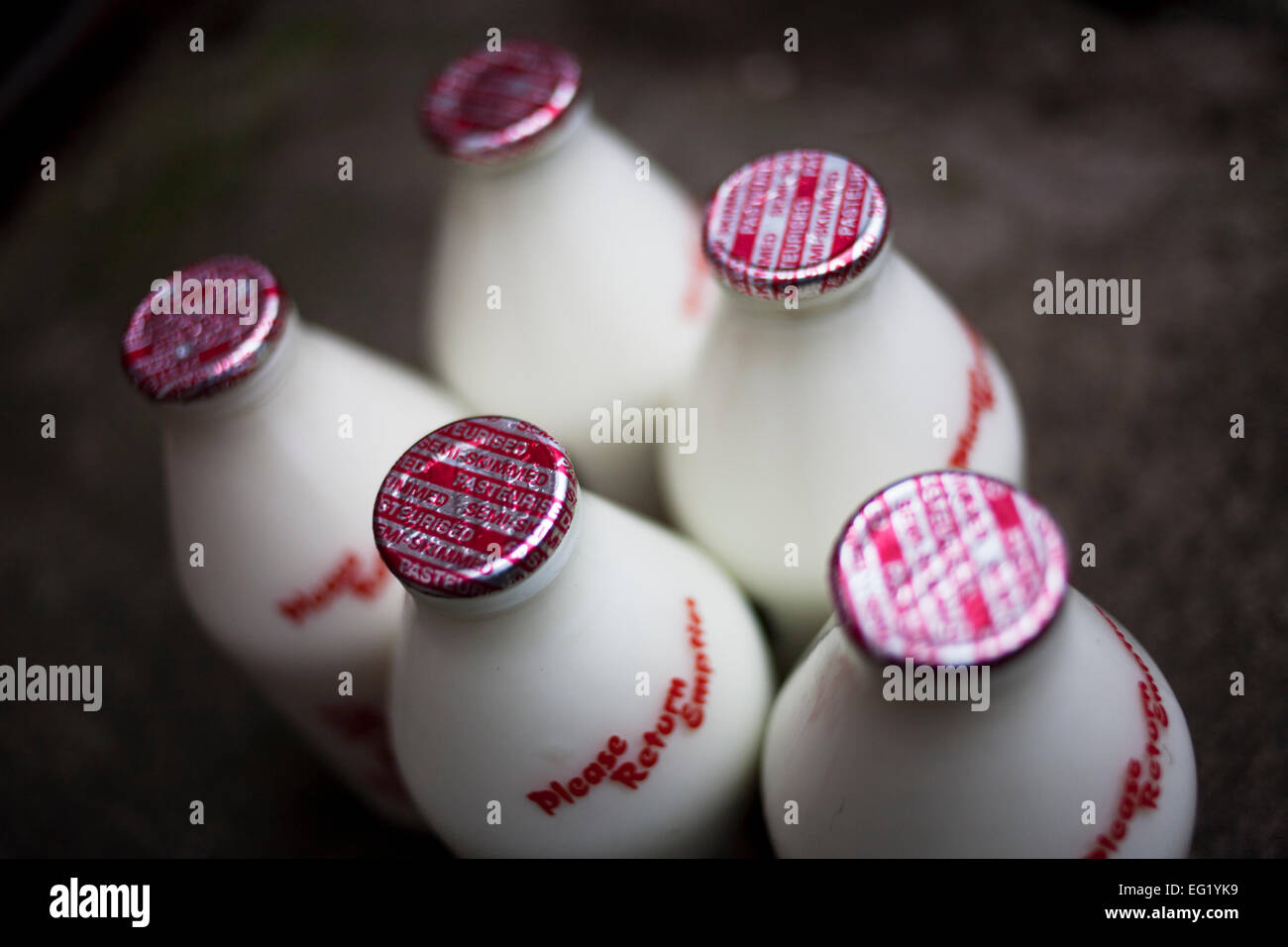 Milk bottles delivered to a household. Stock Photo