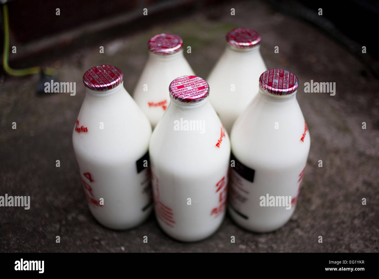 Milk bottles delivered to a household. Stock Photo