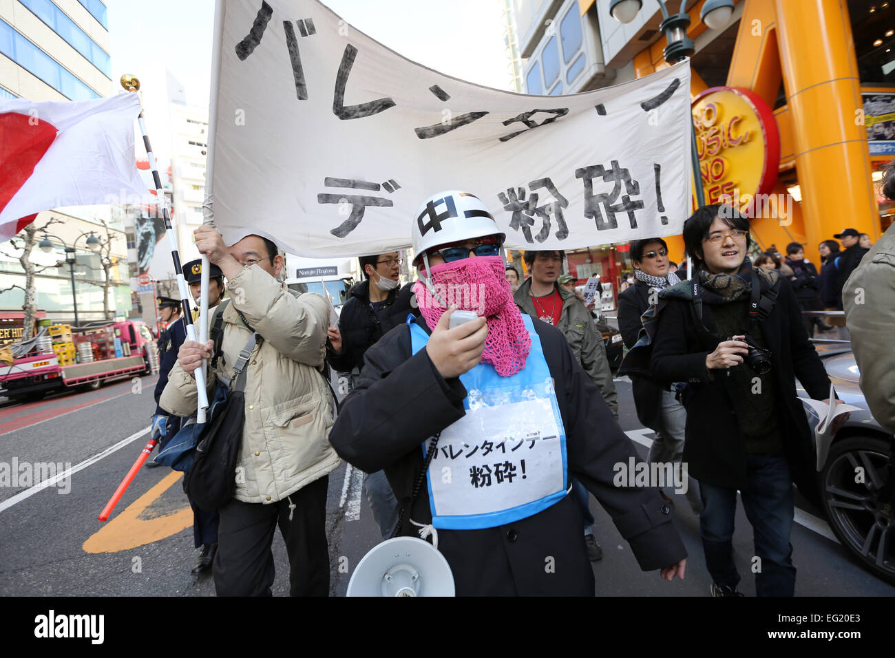 Demonstrators take part in 'Smash Valentine's Day' protest as they march through the streets of Shibuya district in Tokyo, Japan on February 14, 2015. The group called Kakuhidou, meaning 'Revolutionary alliance of men whom women find unattractive' protested that Valentine's Day is only about marketing and making money by chocolate companies. © Yuriko Nakao/AFLO/Alamy Live News Stock Photo