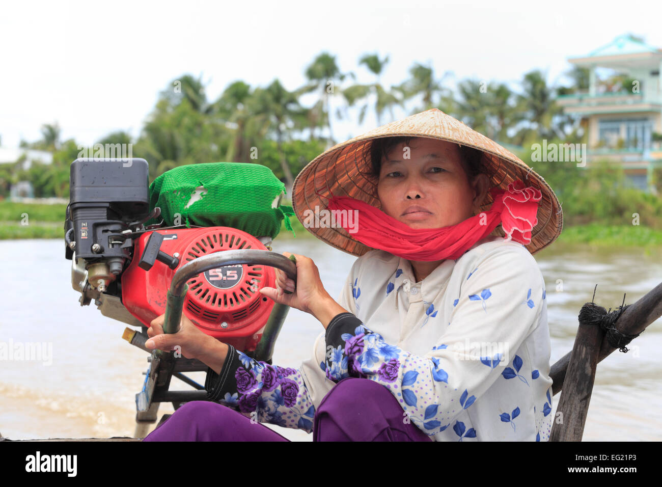 Local woman on motorboat, Mekong river delta, Can Tho, Vietnam Stock Photo