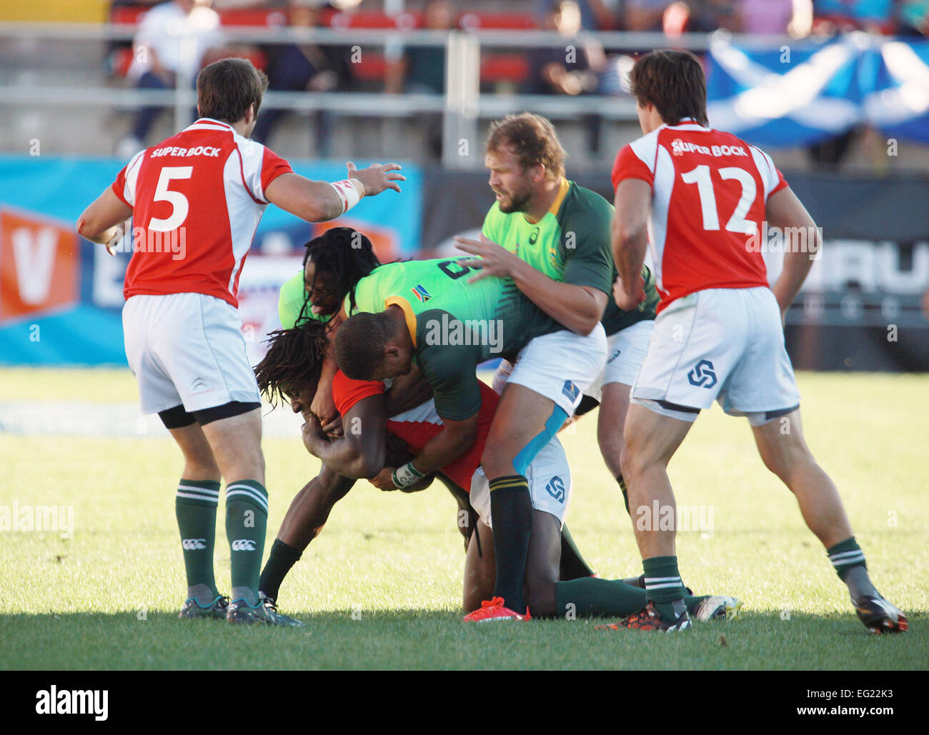 Las Vegas, Nevada, USA. 14th Feb, 2015. Portugal's Aderito Esteves {dreadlocks} is tackled by Springboks players during the USA Sevens Rugby tournament at Sam Boyd Stadium on February 13, 2015 in Las Vegas, Nevada © Marcel Thomas/ZUMA Wire/Alamy Live News Stock Photo