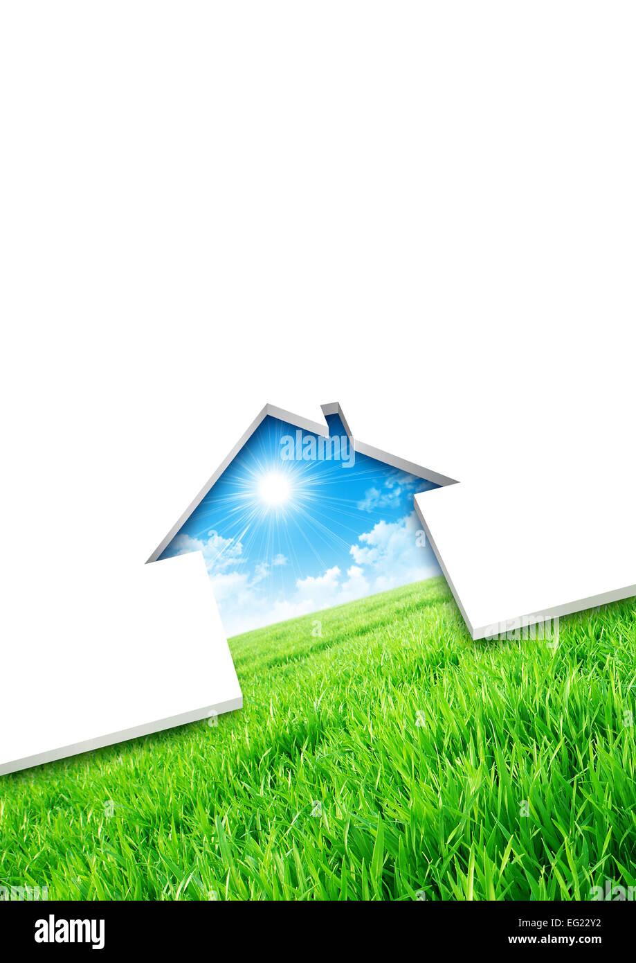 Eco house concept. Cutting of a blank sheet, house shaped above a green field background Stock Photo