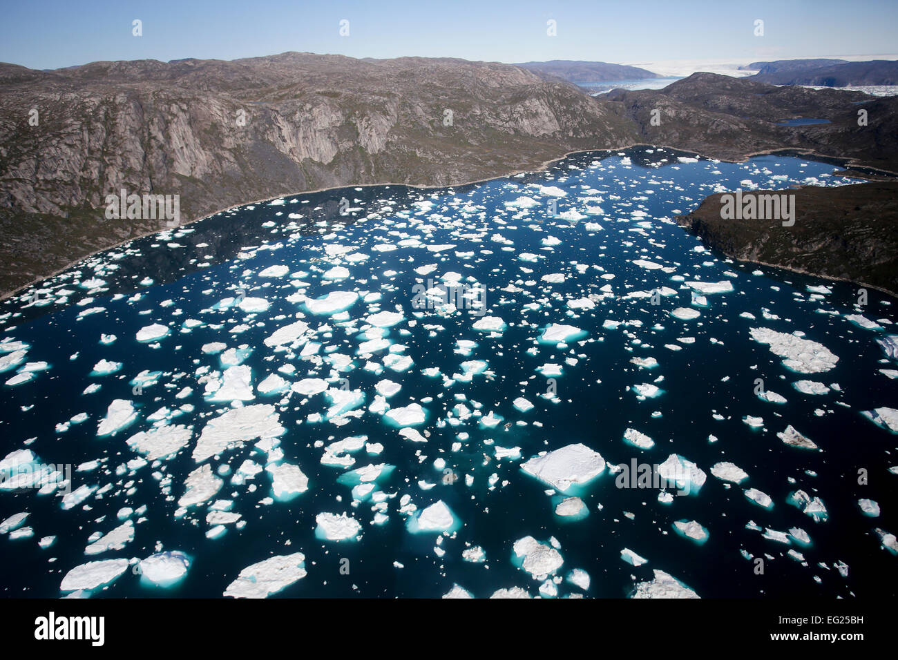 Greenland, Ilulissat, aerial view of bergy bits flowing in to a fjord ...