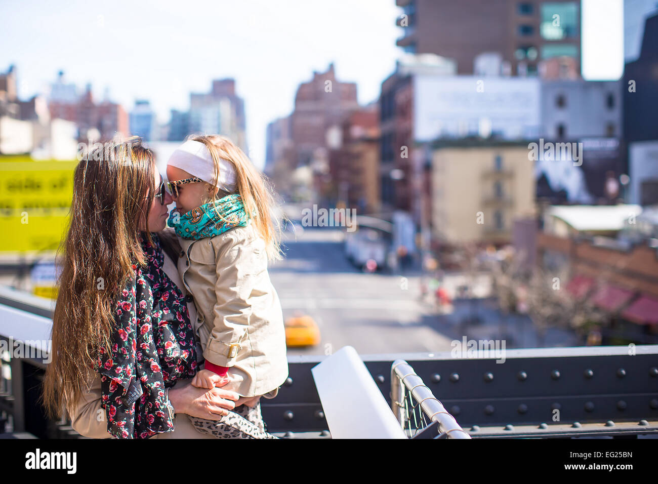 Adorable little girl and mother enjoy sunny day on New York's High Line Stock Photo
