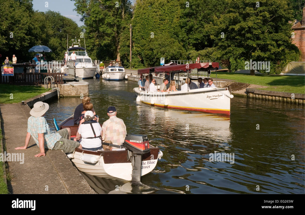 Berks  - river Thames - Hurley Lock - high summer day - passing river traffic - pleasure boats - a launch - reflections Stock Photo