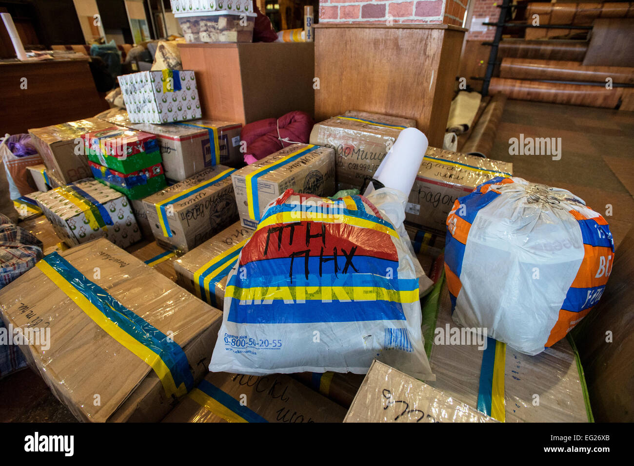 Boxes of food, gathered by common villagers for ATO soldiers fighting at front-line, laying in the local furniture store. Radomyshl, Ukraine, 31 of January, 2015. Photo by Oleksandr Rupeta Stock Photo