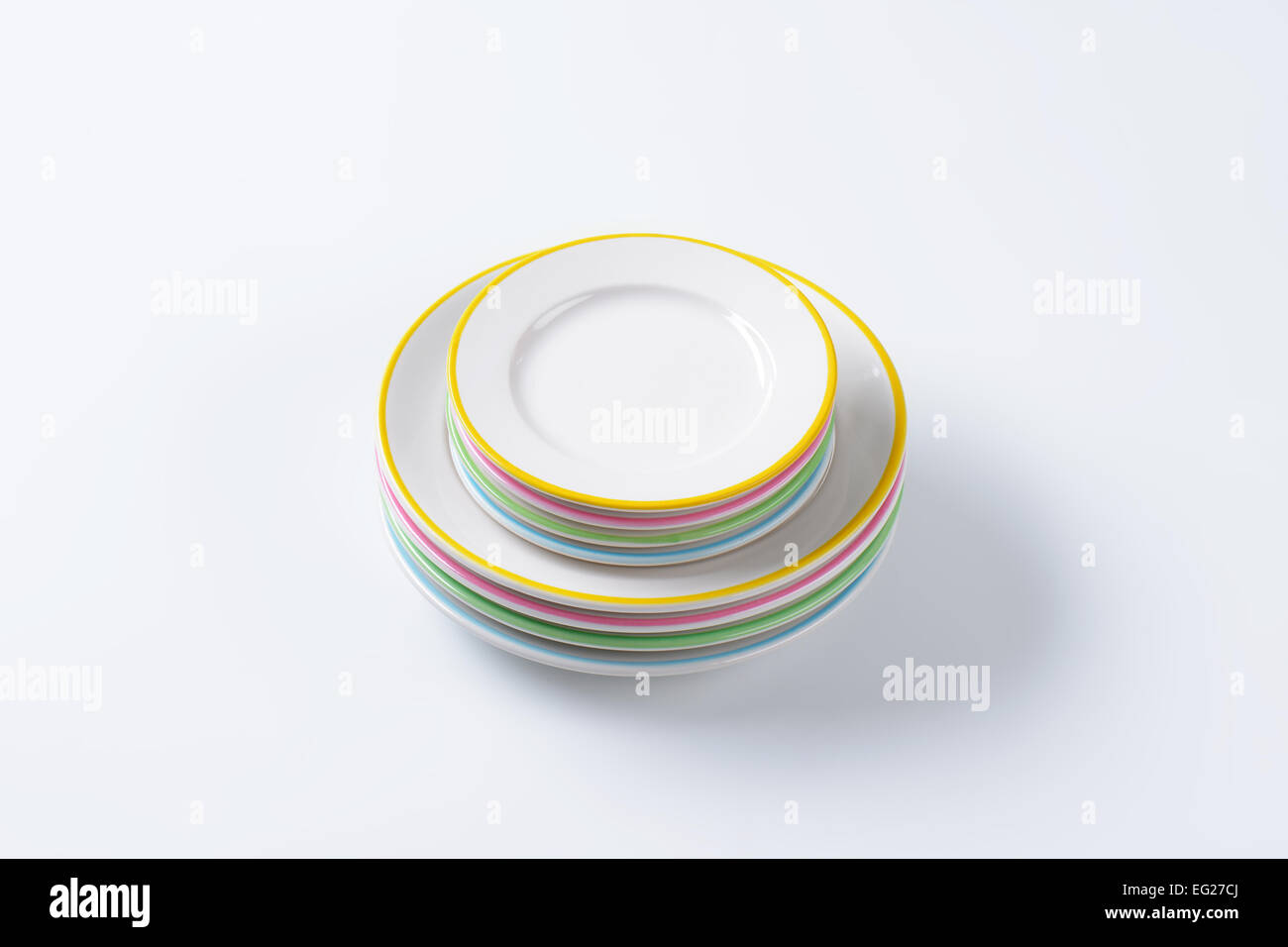 Set of rimmed plates with pastel colored edges Stock Photo Alamy