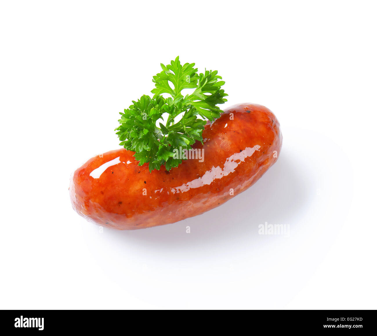 Single cooked beer glazed sausage Stock Photo