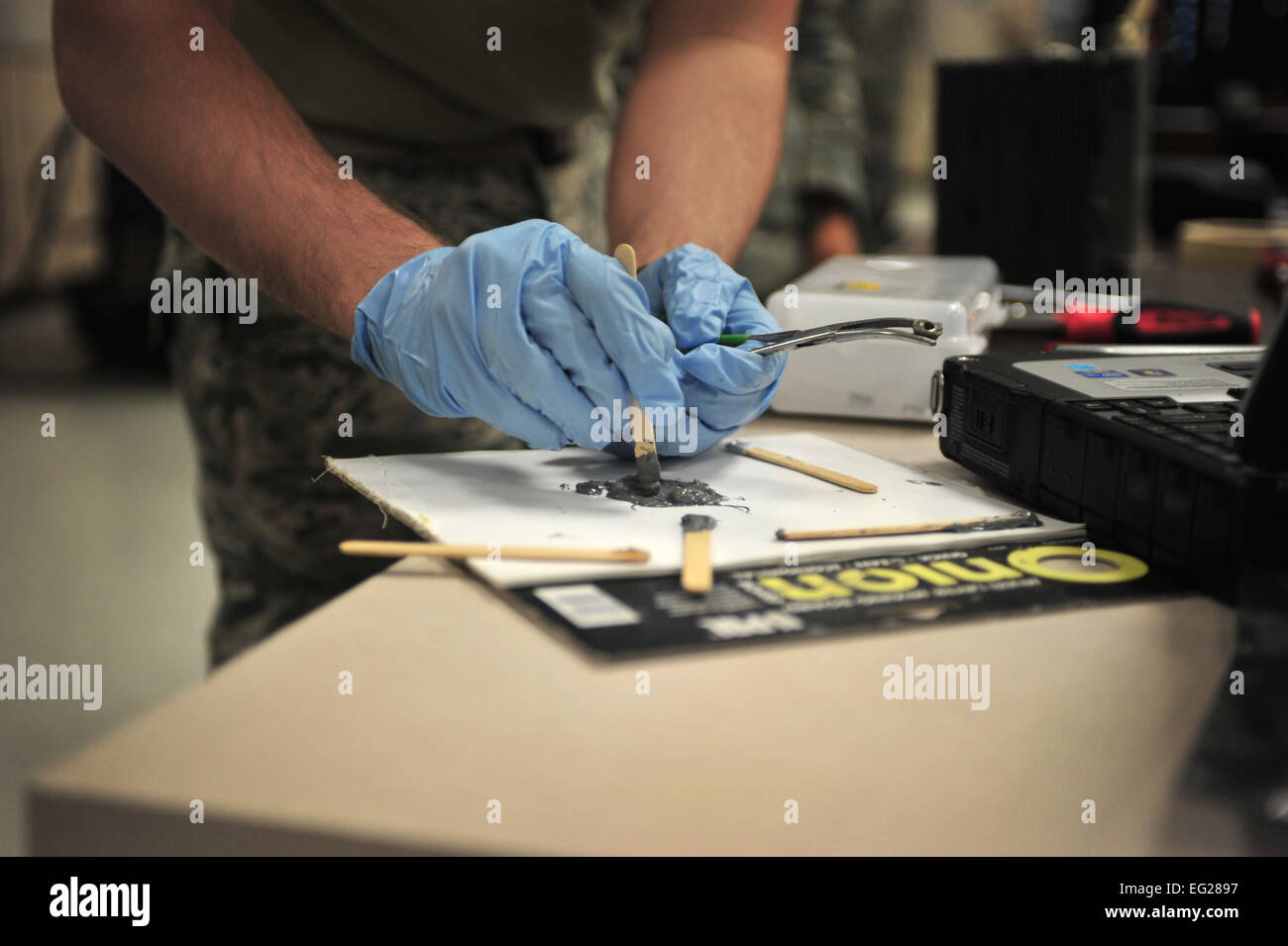 A maintainer with the 27th Special Operations Maintenance Squadron prepares to repair a component of a CV-22 Osprey Dec. 18, 2014, at Cannon Air Force Base, N.M. Avionics systems specialists troubleshoot malfunctions, inspect, remove, install and check out aviation electronic systems with emphasis on in-depth troubleshooting.  Senior Airman Eboni Reece  For more great Air Force photos, visit our Facebook page: www.facebook.com/usairforce  https://www.facebook.com/USairforce  . Stock Photo