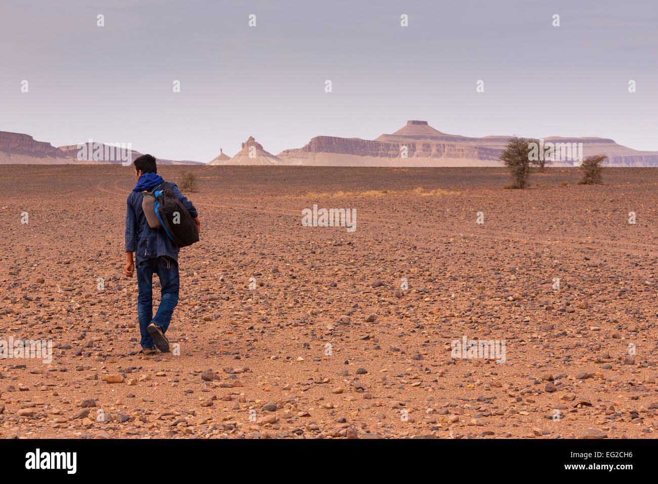Tuareg boy walking in the Moroccan Sahara desert Stock Photo