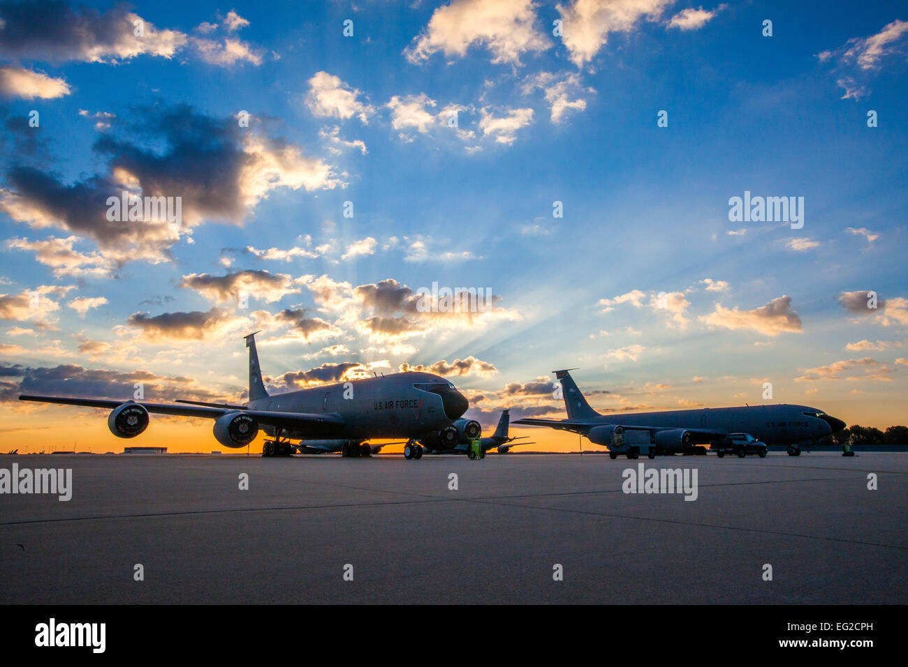 The sun rises above KC-135R Stratotankers on the New Jersey Air National Guard flightline at Joint Base McGuire-Dix-Lakehurst, N.J., Sept. 26, 2014. The KC-135Rs are assigned to the 108th Wing.  Master Sgt. Mark C. Olsen Stock Photo