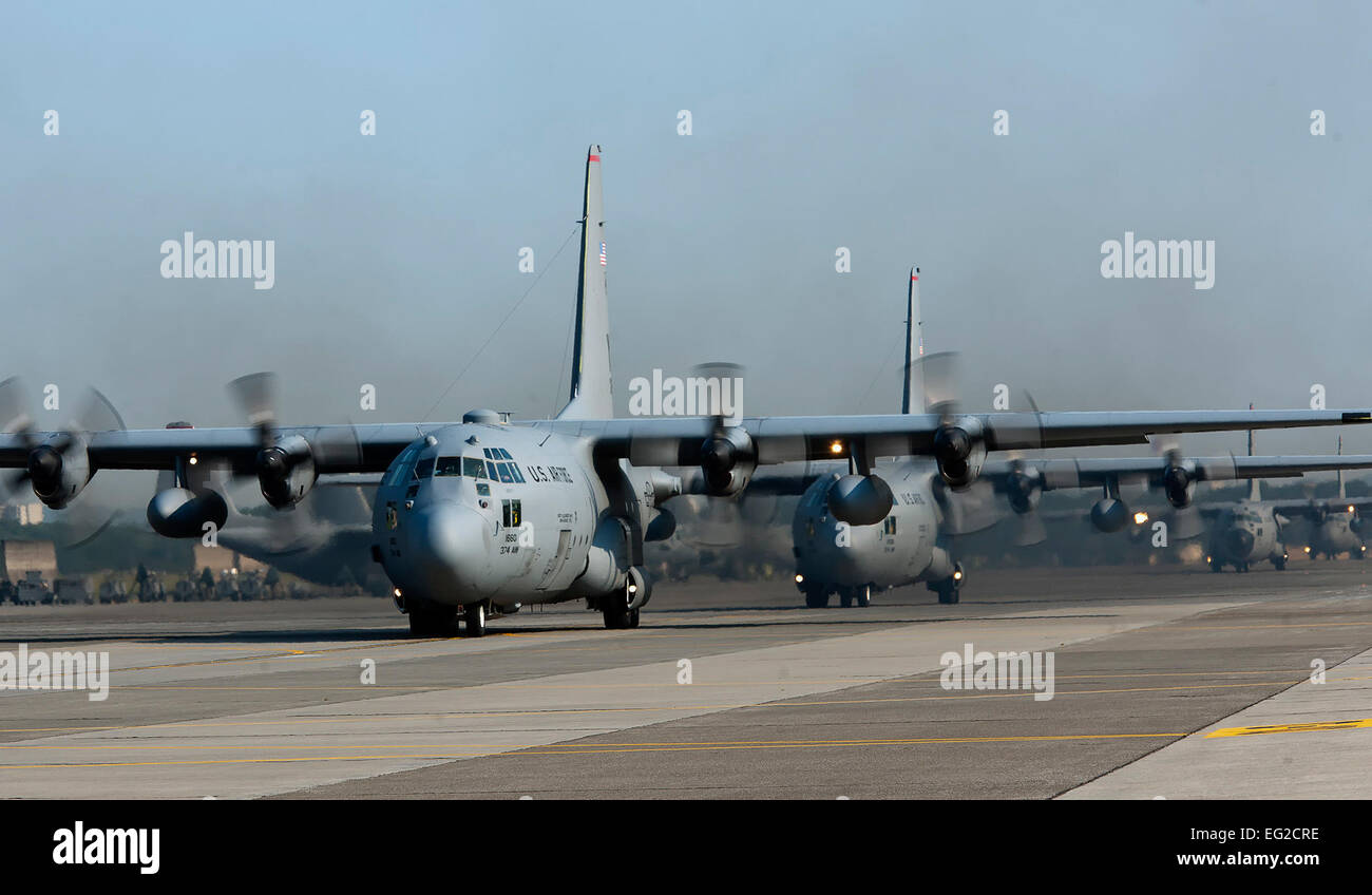 Four C-130 Hercules from the 36th Airlift Squadron taxi out for a training mission during an eight-ship sortie June 4, 2012, at Yokota Air Base, Japan. The training tested Yokota AB Airmen’s ability to perform large-force employment and tactics.  Osakabe Yasuo Stock Photo