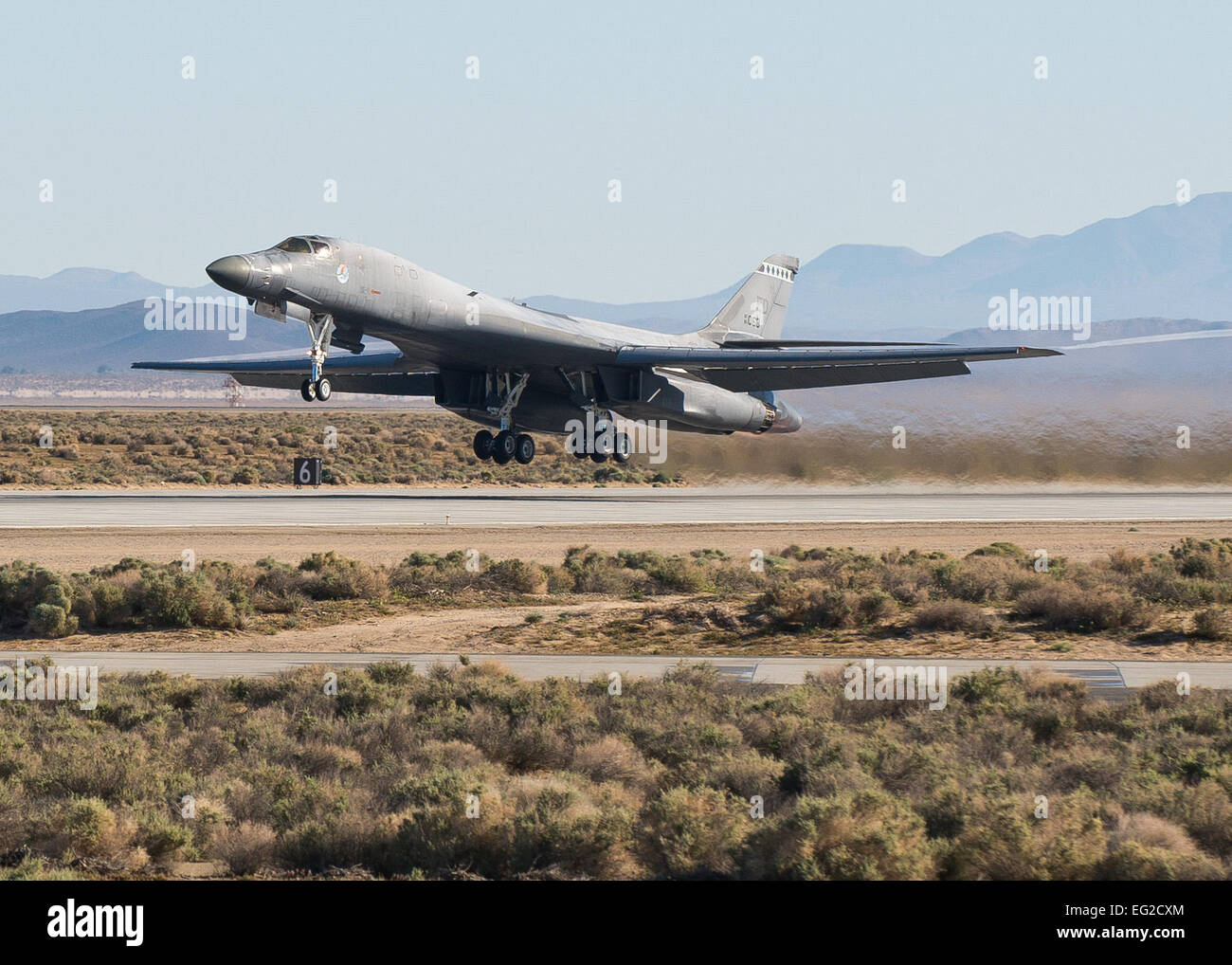 An Edwards B-1B Lancer takes off Runway 22L on April 1, 2014, to begin testing its Sustainment Block 16A software upgrades. The SB 16A software will work in conjunction with the long-range bomber’s new glass cockpit configuration in order to ensure its capabilities in a fast-paced integrated battlefield of the future.  Ethan Wagner Stock Photo