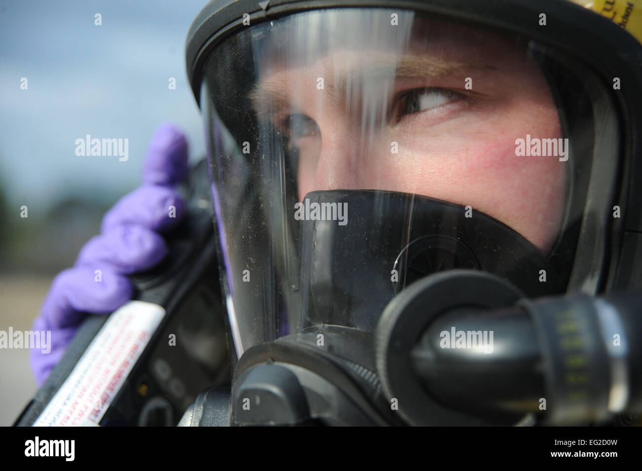 U.S. Air Force Senior Airman Jordan Gagne, 20th Aerospace Medicine Squadron bioenvironmental engineering journeyman, speaks on a radio during an integrated base emergency response capability training at Shaw Air Force Base, S.C., Dec. 9, 2014. The 20th Civil Engineer Squadron emergency management flight and the 20th AMDS bioenvironmental flight were tested on their abilities to react and work together in the event a chemical attack were to happen on base.  Airman 1st Class Michael Cossaboom Stock Photo