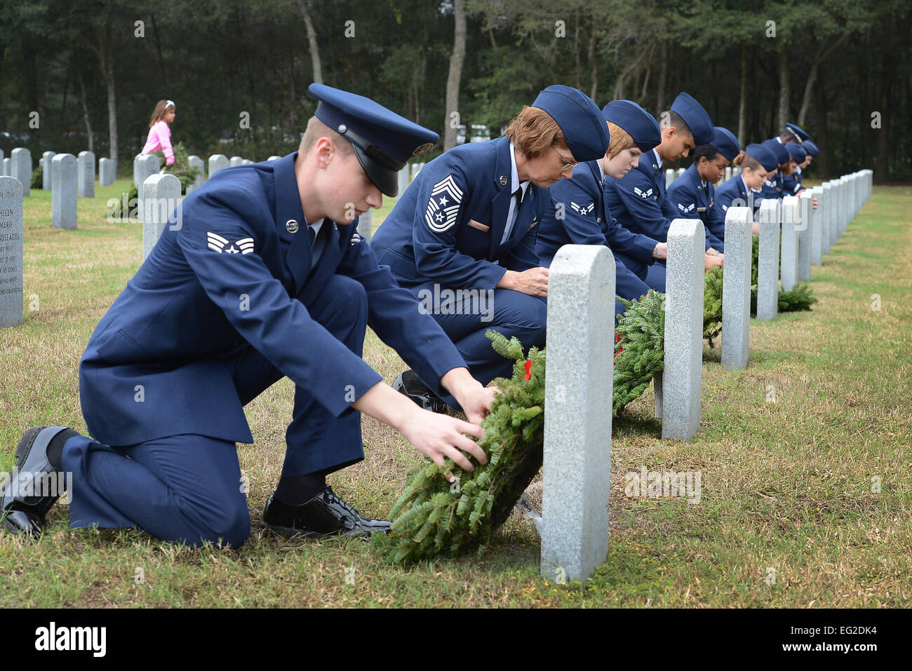 Airmen from MacDill Air Force Base, Fla., place wreaths on the graves
