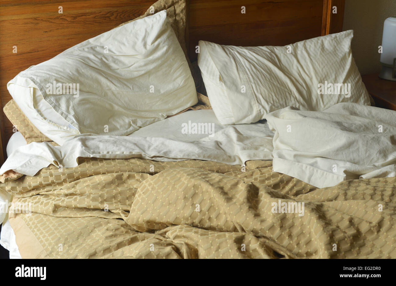 An unmade double bed Stock Photo Alamy