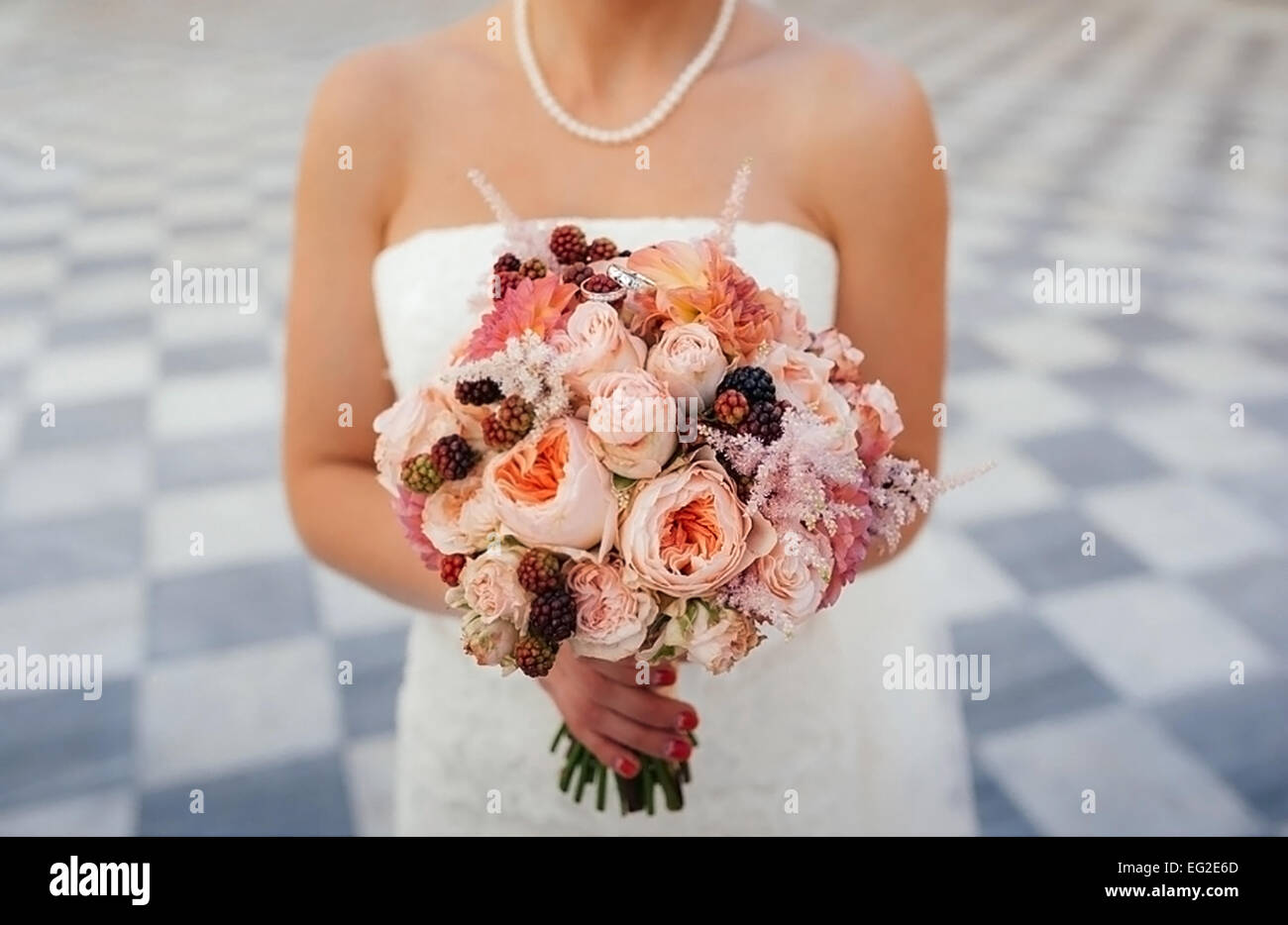 Bride holding white wedding bouquet of roses and love flower Stock ...