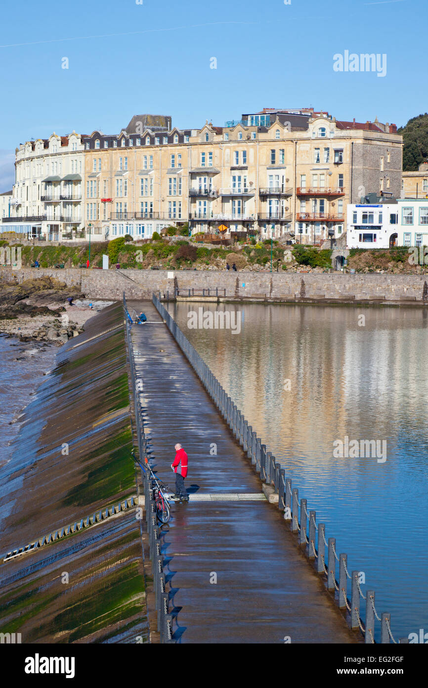 Fisherman trying their luck in the tidal Marine Lake at Weston-super-Mare, North Somerset, England, UK Stock Photo