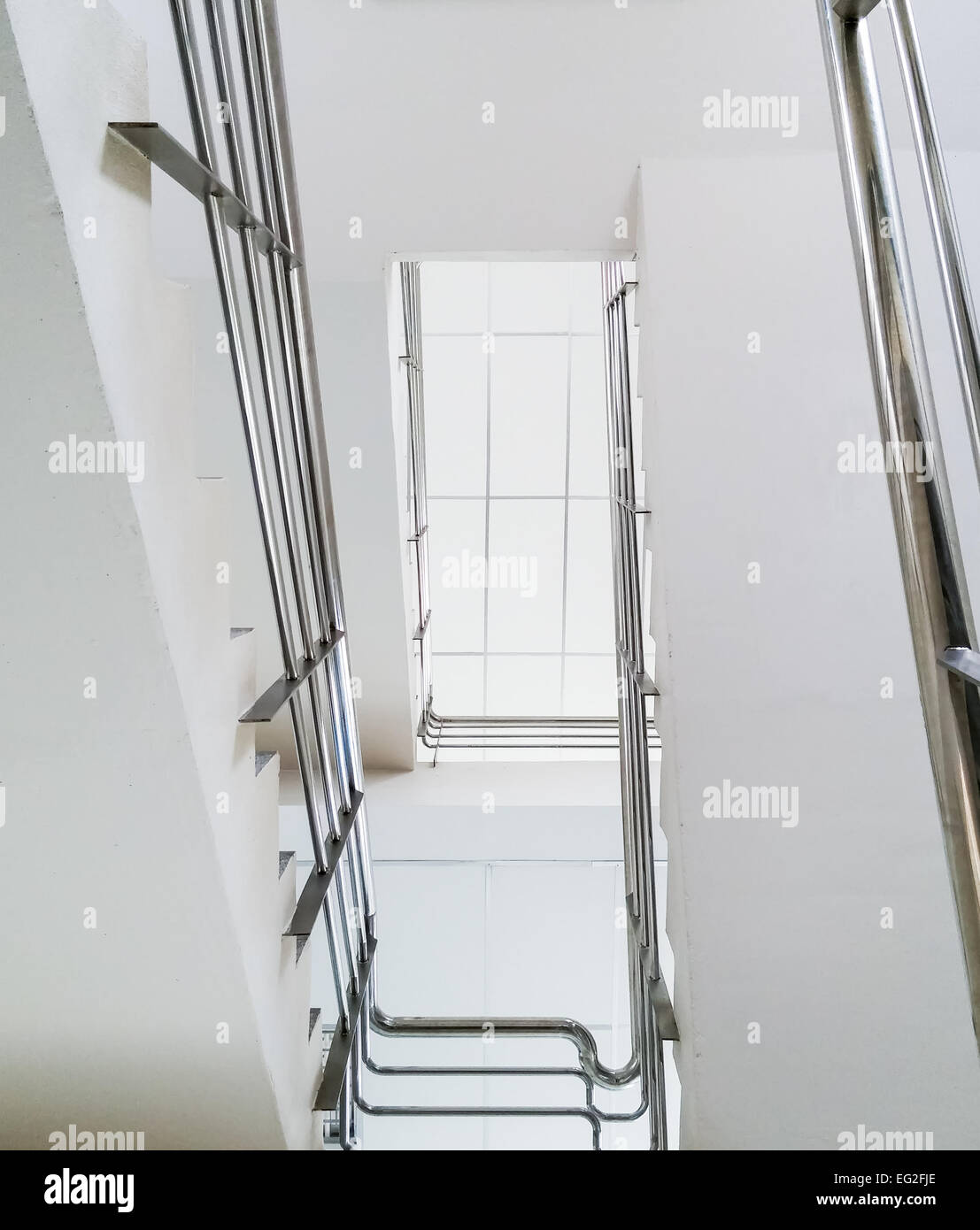 Modern staircase  to the top of small office in urban city. Stock Photo