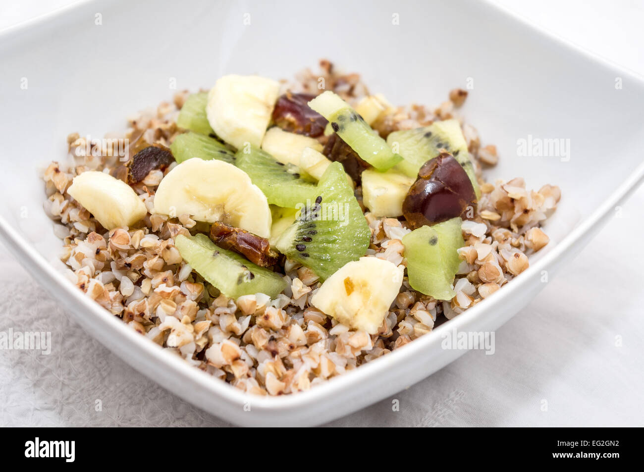 Healthy breakfast - Raw vegan fruit salad with buckwheat Stock Photo