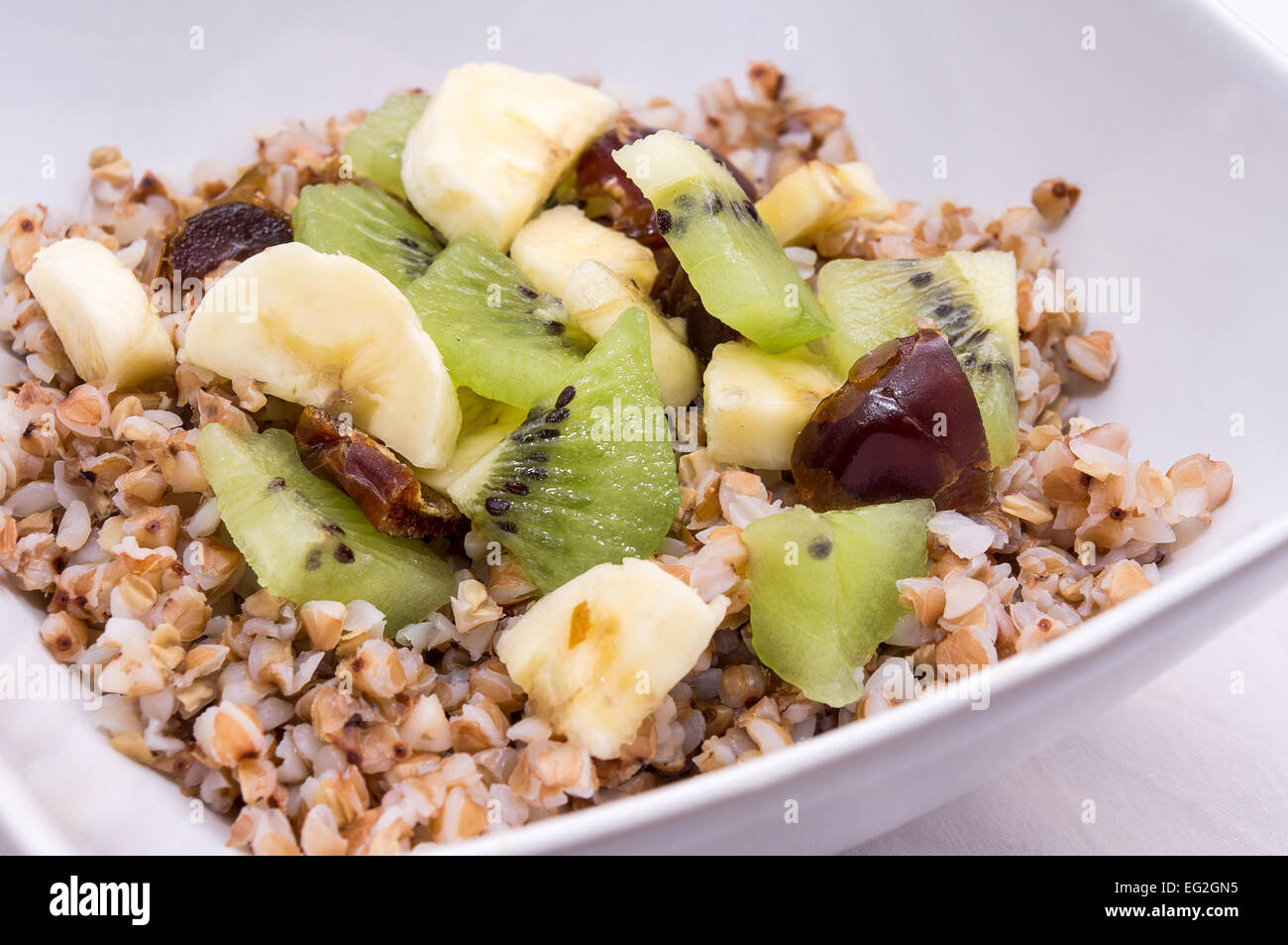 Healthy breakfast - Raw vegan fruit salad with buckwheat Stock Photo