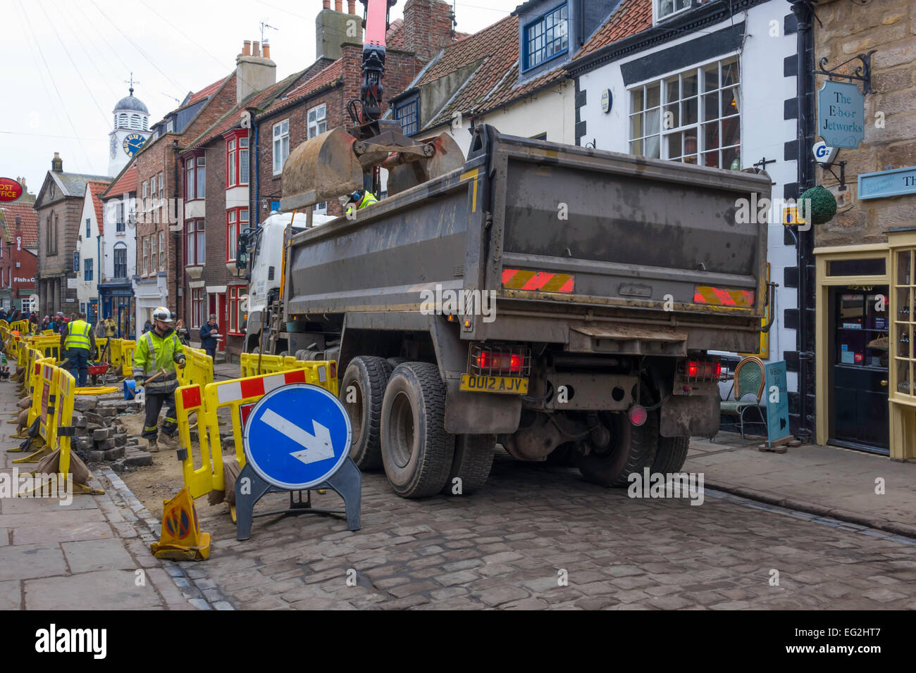 Inconvenient blockage by contractors truck while repairing a gas main in narrow cobbled  Church Street Whitby North Yorkshire. Stock Photo