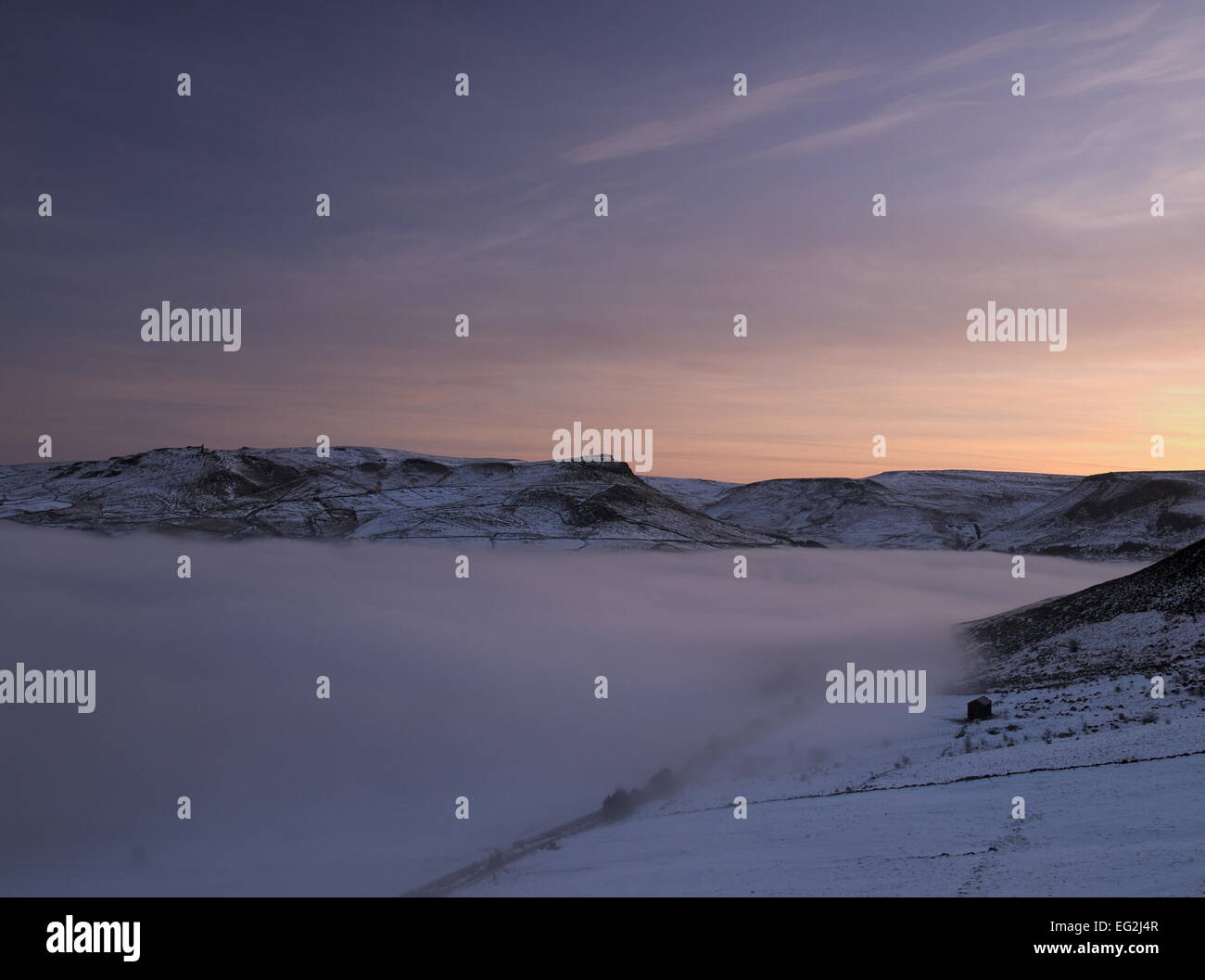 Dawn light rises over a cloud filled Chew Valley. Stock Photo