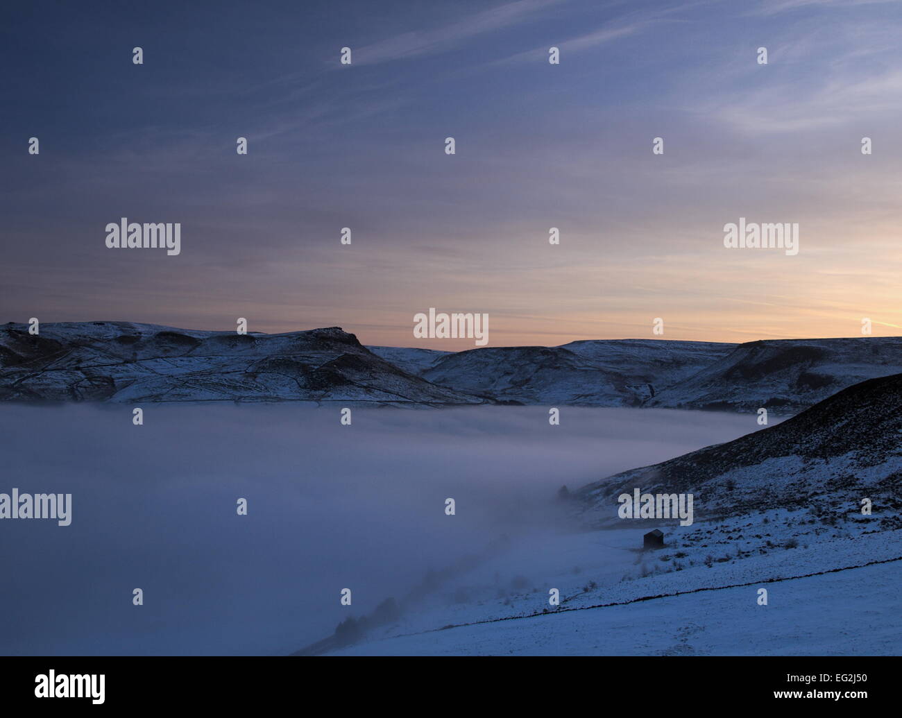 Dawn light rises over a cloud filled Chew Valley. Stock Photo