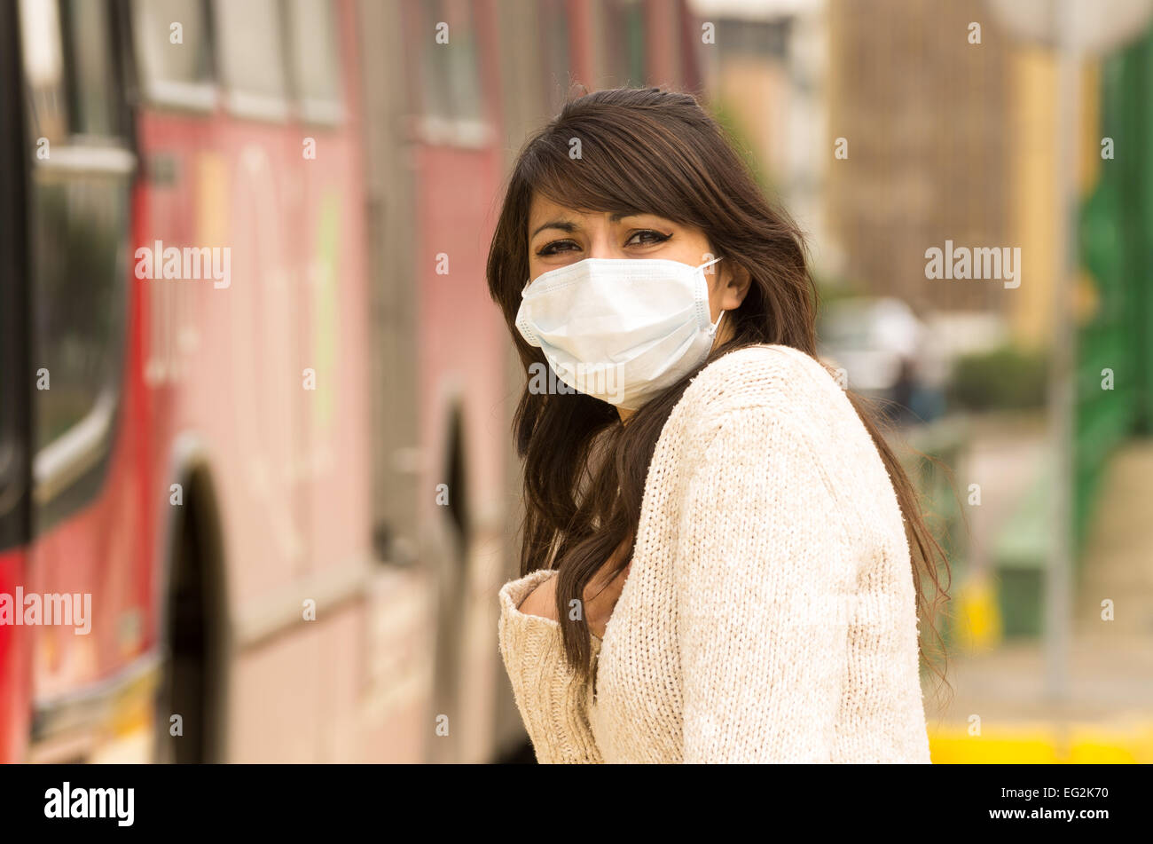 young girl walking wearing a mask in the city street concept of