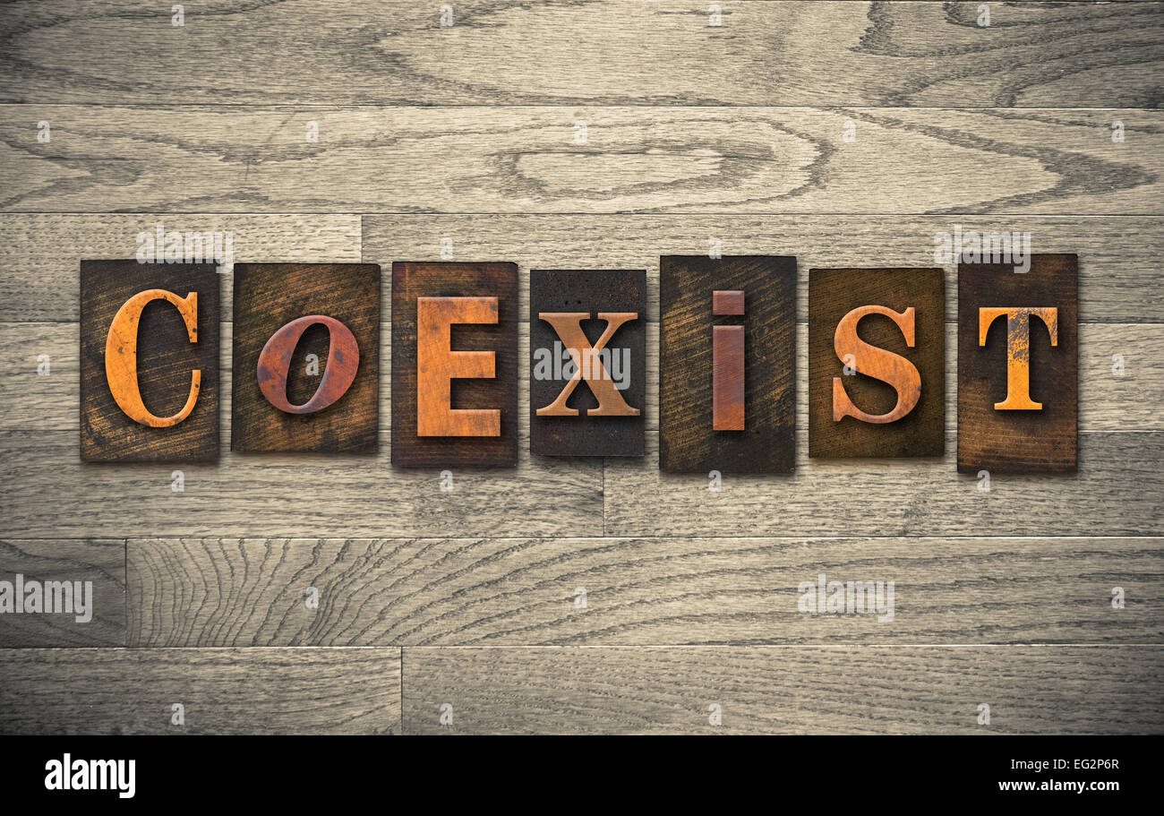 The word "COEXIST" written in vintage wooden letterpress type Stock Photo