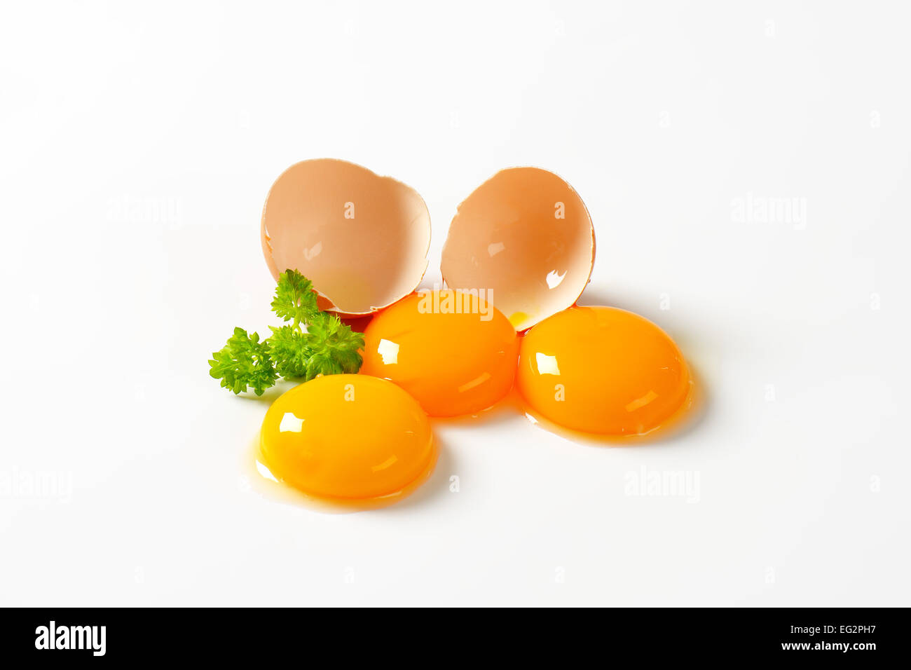 Raw egg yolk on white background Stock Photo Alamy