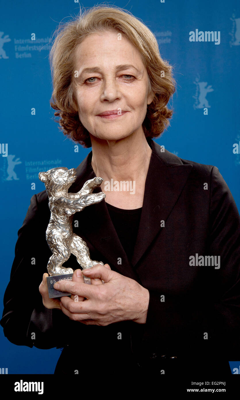 Berlin, Germany. 14th Feb, 2015. British actor Charlotte Rampling holds up the Silver Bear for Best Actor, which she won for the film '45 Years' at the 65th International Film Festival in Berlin, Germany, 14 February 2015. Photo: Tim Brakemeier/dpa/Alamy Live News Stock Photo