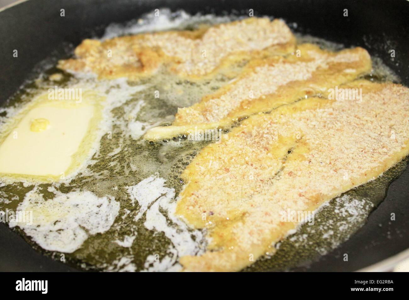 beef breaded with butter cooking in pot Stock Photo Alamy